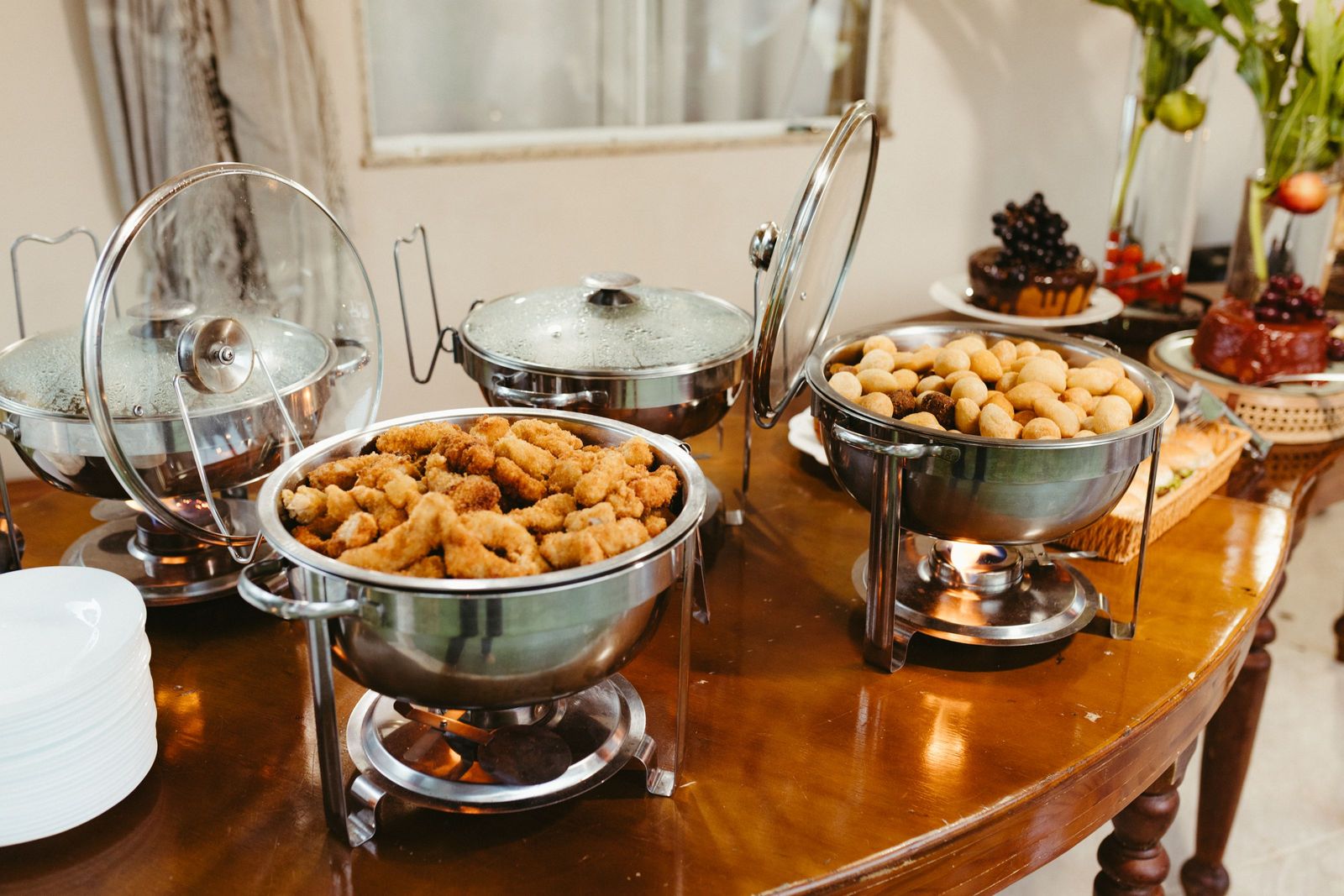 A buffet of assorted appetisers laid out along a cloth-covered table